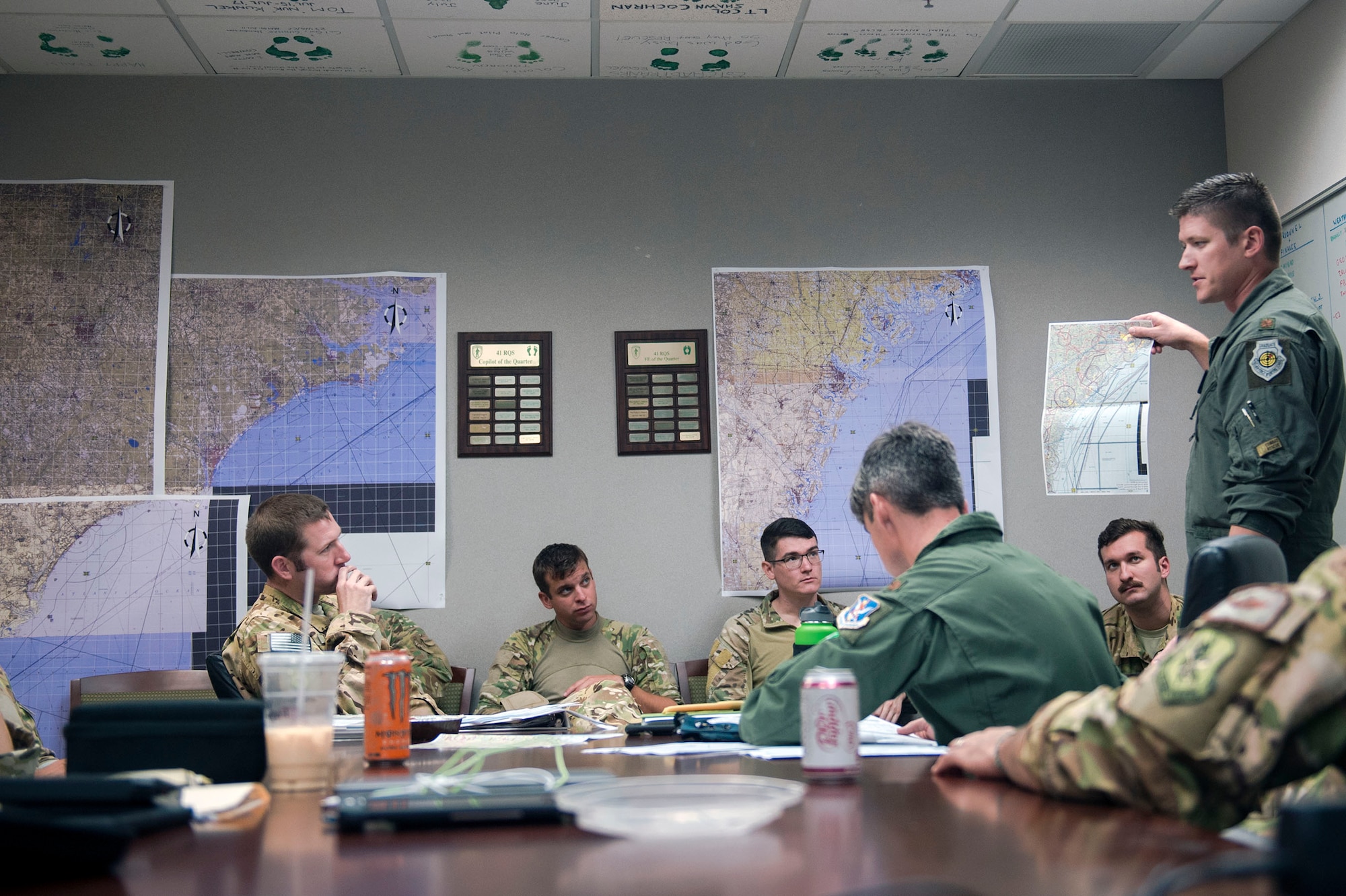 Maj. Kevin Rynbrandt, 23d Wing Chief of plans and programs, conducts a pre-brief, Sept. 15, 2018, at Moody Air Force Base, Ga. The 334th Air Expeditionary Group launched HC-130J Combat King IIs, HH-60G Pavehawks, aircrew and support personnel to pre-position at Joint Base Charleston, S.C., for potential Tropical Storm Florence response. Under the command of Col. John Creel, the 374th Rescue Group commander, the AEG integrated to make one expeditionary search and rescue unit comprised of rescue and support personnel from both the 23d Wing, 920th Rescue Wing at Patrick Air Force Base, Fla., and 51st Combat Communications Squadron at Robins Air Force Base, Ga. (U.S. Air Force photo by Senior Airman Greg Nash)