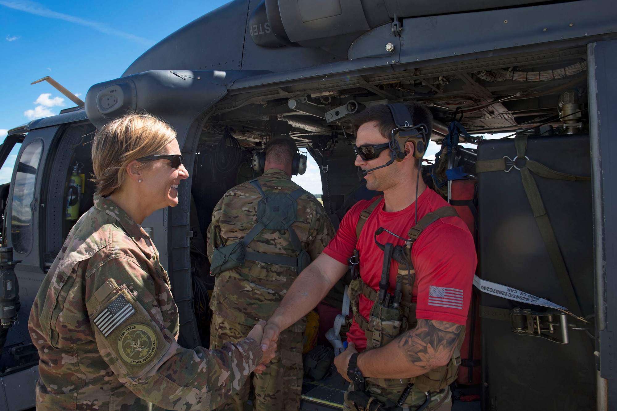 Col. Jennifer Short, 23d Wing commander, left, bids farewell to an Airman from the 38th Rescue Squadron departing for recovery operations in support of Tropical Storm Florence, Sept. 15, 2018, at Moody Air Force Base, Ga. The 334th Air Expeditionary Group launched HC-130J Combat King IIs, HH-60G Pavehawks, aircrew and support personnel to pre-position at Joint Base Charleston, S.C., for potential Tropical Storm Florence response. Under the command of Col. John Creel, the 374th Rescue Group commander, the AEG integrated to make one expeditionary search and rescue unit comprised of rescue and support personnel from both the 23d Wing, 920th Rescue Wing at Patrick Air Force Base, Fla., and 51st Combat Communications Squadron at Robins Air Force Base, Ga. (U.S. Air Force photo by Senior Airman Greg Nash)