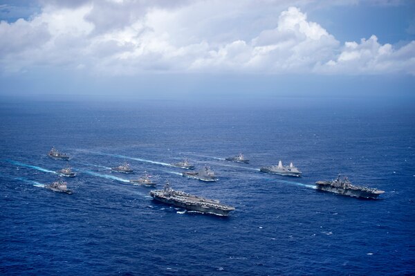 File photo of USS Ronald Reagan (CVN 76) and USS Bonhomme Richard (LHD 6) lead a formation of Carrier Strike Group Five and Expeditionary Strike Group Seven ships including, USS Momsen (DDG 92), USS Chancellorsville (CG 62), USS Stethem (DDG 63), USS Benfold (DDG 65), USS Curtis Wilbur (DDG 54), USS Germantown (LSD 42), USS Barry (DDG 52), USS Green Bay (LPD 20), USS McCampbell (DDG 85), as wells as USNS Walter S. Diehl (T-AO 193) during a photo exercise to signify the completion of Valiant Shield 2016.