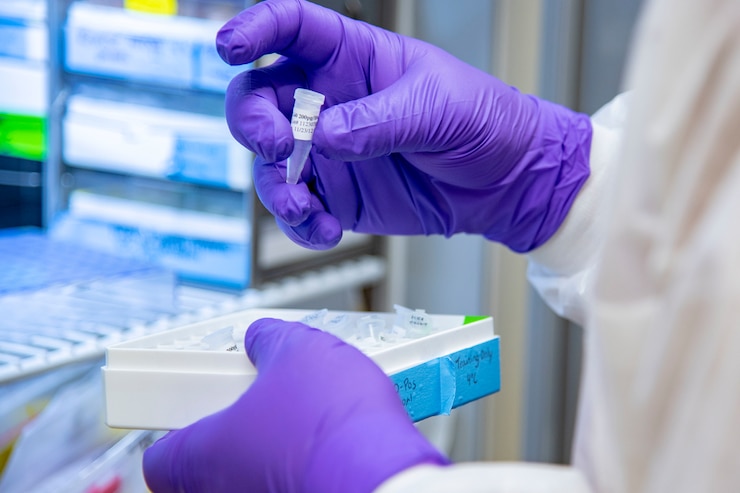 A DNA analyst checks expiration dates on reagents.