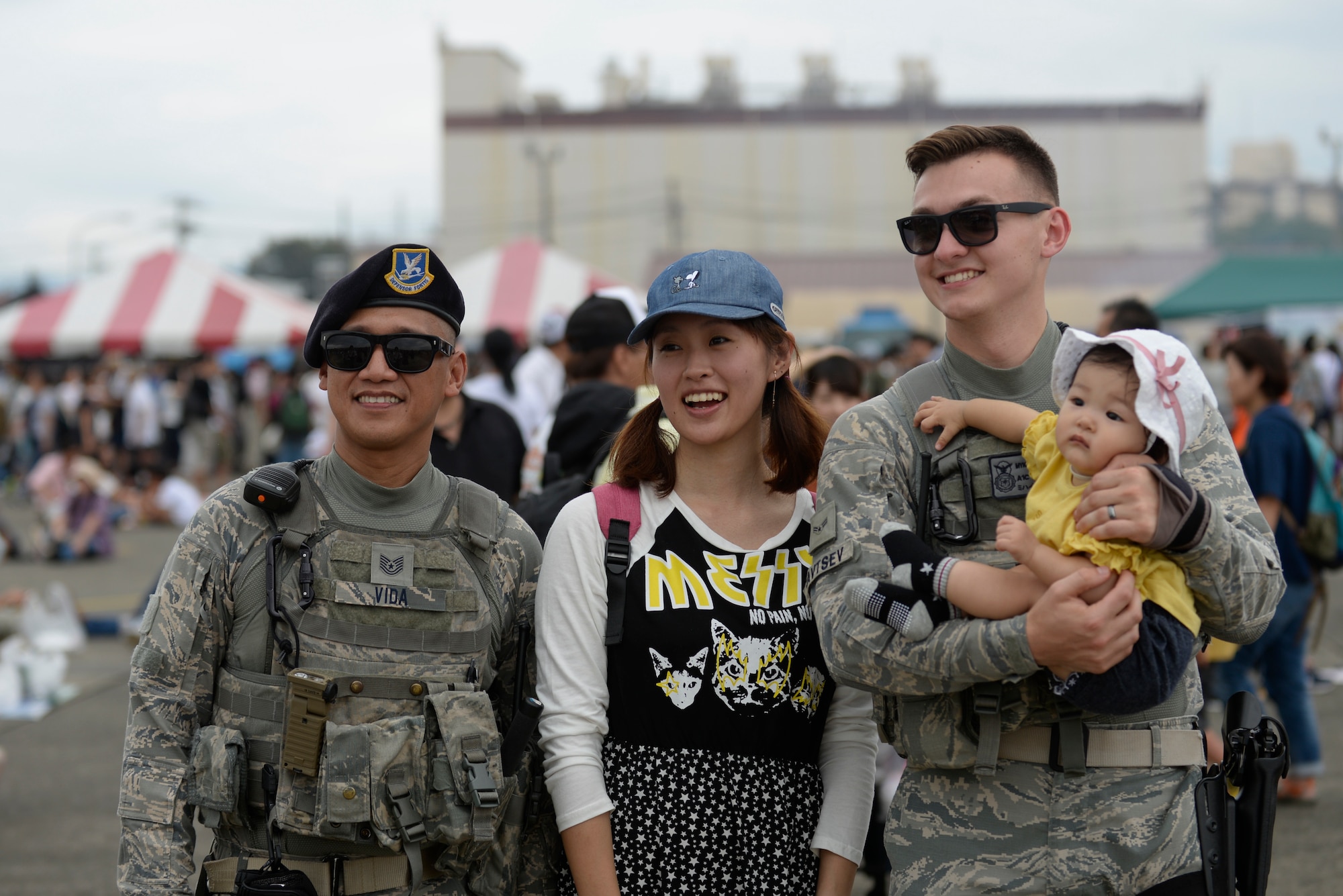 Festivalgoers pose with Airmen for a photo during the 2018 Japanese-American Friendship Festival, Sept. 16, 2018, at Yokota Air Base, Japan.