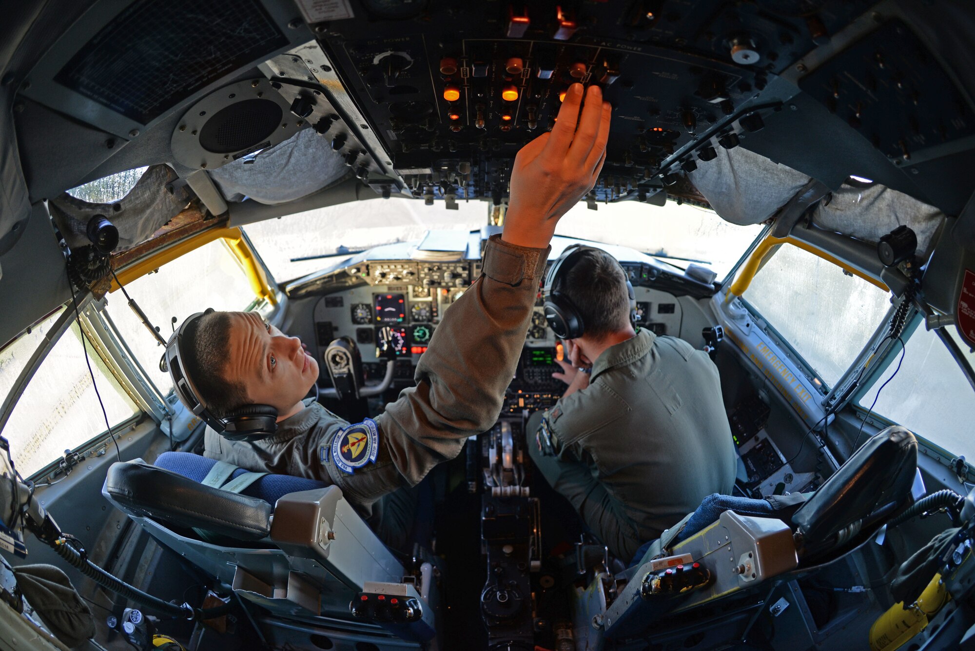 U.S. Air Force Capt. Ryan Nelson, left, and Maj. Matthew Boatman, 351st Air Refueling Squadron pilots, conduct pre-flight checks of a KC-135 Stratotanker prior to performing an air-refueling mission, at RAF Mildenhall, England, Sept. 15, 2018. The mission included the refueling of a B-52 Stratofortress from the 307th Bomb Wing at Barksdale, Louisiana, deployed to RAF Fairford, England. (U.S. Air Force photo by Senior Airman Luke Milano)