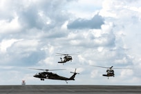 Aircrews with the North Carolina Army National Guard land three UH-60 Black Hawk helicopters on the flight line at Charlotte Air National Guard Base, N.C., as part of storm preparation for Hurricane Florence, Sept.12, 2018. Hurricane Florence is one of the largest storms to hit the Carolinas and has ignited a massive response from emergency services.