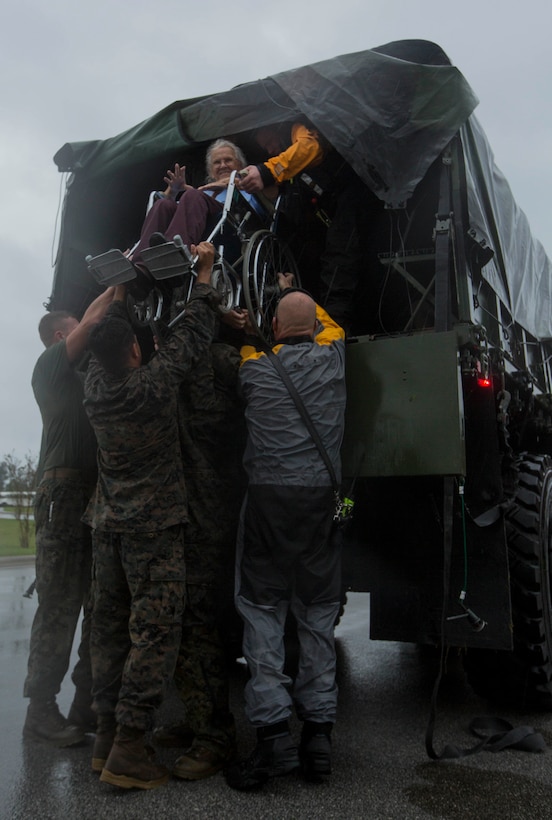 U.S. Marines assigned to Combat Logistics Group 8 (CLB-8) assist the local first responders in evacuating civilians in Jacksonville, N.C., Sept. 15, 2018. CLB-8 provided direct logistical support in providing disaster relief to civilians affected by Hurricane Florence.