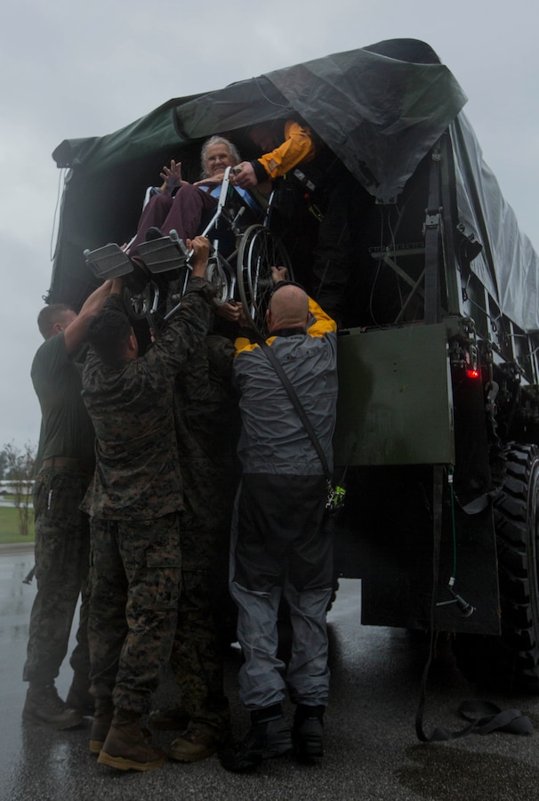 U.S. Marines assigned to Combat Logistics Group 8 (CLB-8) assist the local first responders in evacuating civilians in Jacksonville, N.C., Sept. 15, 2018. CLB-8 provided direct logistical support in providing disaster relief to civilians affected by Hurricane Florence.