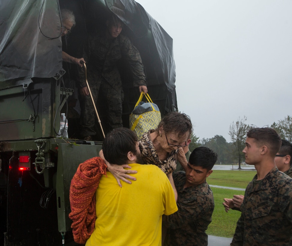 U.S. Marines assigned to Combat Logistics Group 8 aid in evacuating the local populace in Jacksonville, N.C., Sept. 15, 2018. CLB-8 provided direct logistical support in providing disaster relief to civilians affected by Hurricane Florence.