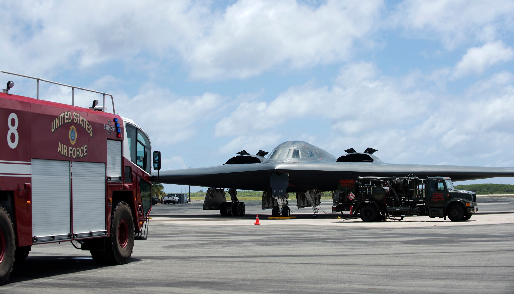 A U.S. Air Force B-2 Spirit, deployed from Whiteman Air Force Base, Missouri, connects to a fuels truck during a hot-pit refueling at Wake Island Airfield Sept. 14, 2018.