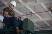 Lance Cpl. Dario Covarrubias operates the crane of an Amphibious Assault Vehicle R7 during the reassembly of a M777 A2 Medium Towed Howitzer Sept. 14, 2018, at Camp Hansen, Okinawa, Japan. Armament Repair Platoon repairs weapons in support of 3rd Battalion, 12th Marine Regiment, 3rd Marine Division to ensure the safety of the Marines operating the weapons. Covarrubias is an AAV mechanic with Armament Repair Platoon, Ordnance Maintenance Company, 3rd Maintenance Battalion, Combat Logistics Regiment 35, 3rd Marine Logistics Group, and is a native of Chicago, Illinois. (U.S. Marine Corps photo by Pfc. Terry Wong)