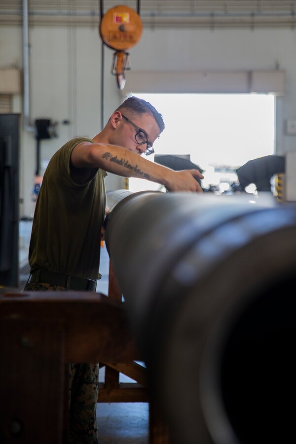 Lance Cpl. Sidney Vanderhook spreads Wide Temperature Range lubricant to a cannon tube during the reassembly of a M777 A2 Medium Towed Howitzer Sept. 14, 2018, at Camp Hansen, Okinawa, Japan. Armament Repair Platoon repairs weapons in support of 3rd Battalion, 12th Marine Regiment, 3rd Marine Division to ensure the safety of the Marines operating the weapons. Vanderhook is an artillery mechanic with Armament Repair Platoon, Ordnance Maintenance Company, 3rd Maintenance Battalion, Combat Logistics Regiment 35, 3rd Marine Logistics Group, and is a native of Southaven, Mississippi. (U.S. Marine Corps photo by Pfc. Terry Wong)