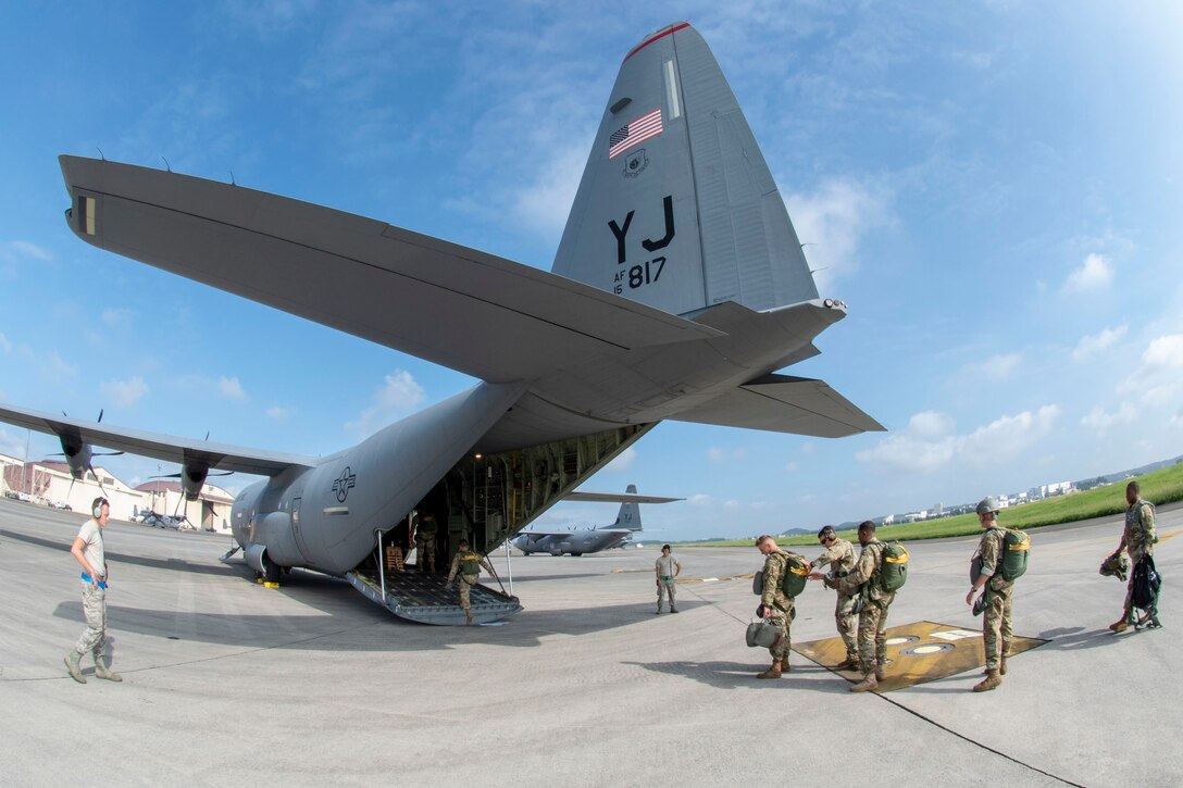 U.S. Army 1st Special Forces Group members board a C-130J Super Hercules in preparation for a static line jump demonstration at the 2018 Japanese-American Friendship Festival at Yokota Air Base, Japan, Sept. 16, 2018.