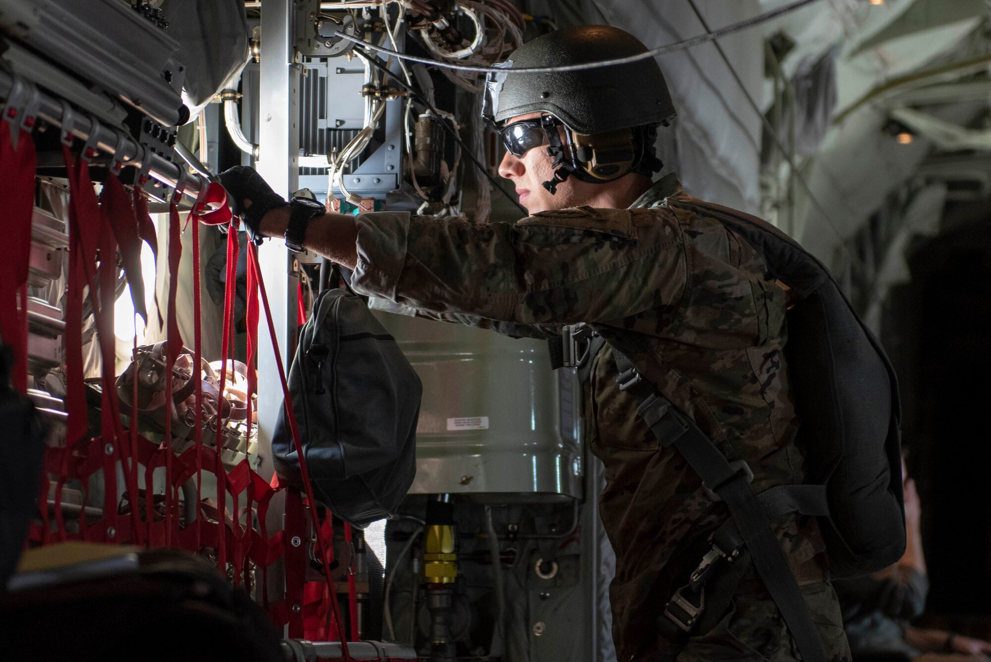 U.S. Army 1st Lt. Nicholas Bonavia, 1st Special Forces Group jumpmaster, looks out of the window of a C-130J Super Hercules in preparation for a static line jump demonstration at the 2018 Japanese-American Friendship Festival at Yokota Air Base, Japan, Sept. 16, 2018.