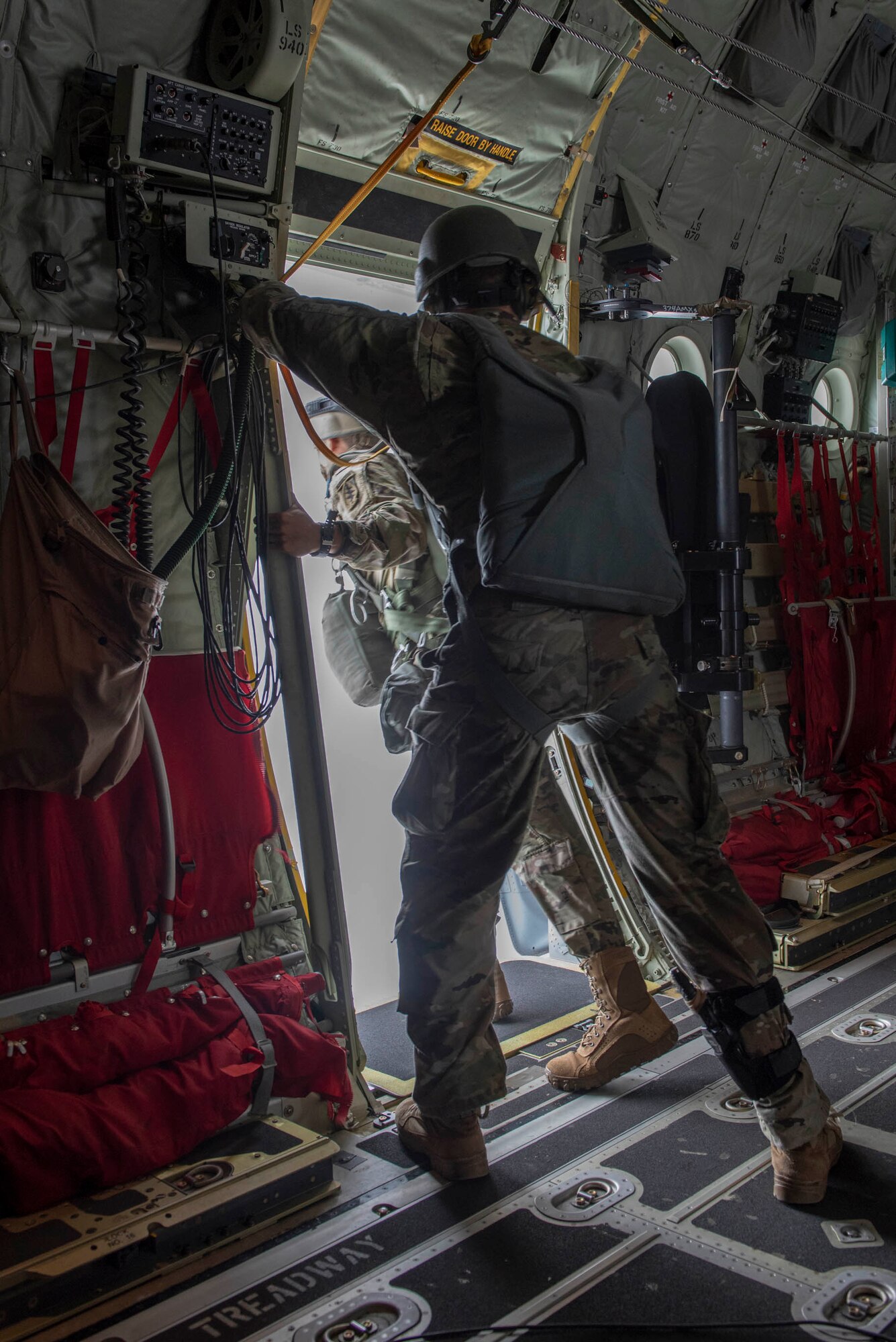 U.S. Army 1st Lt. Nicholas Bonavia, 1st Special Forces Group jumpmaster, stands by as the first jumper prepares to perform a static line jump demonstration at the 2018 Japanese-American Friendship Festival at Yokota Air Base, Japan, Sept. 16, 2018.