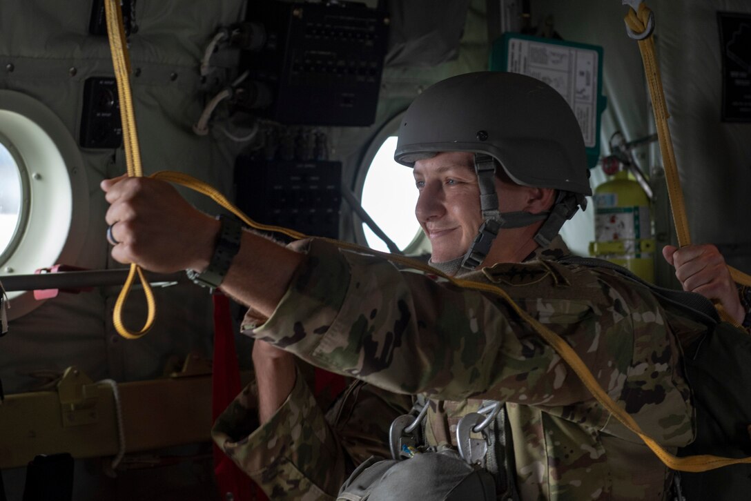 A member of the U.S. Army 1st Special Forces Group smiles before being cleared to jump during a static line jump demonstration at the 2018 Japanese-American Friendship Festival at Yokota Air Base, Japan, Sept. 16, 2018.