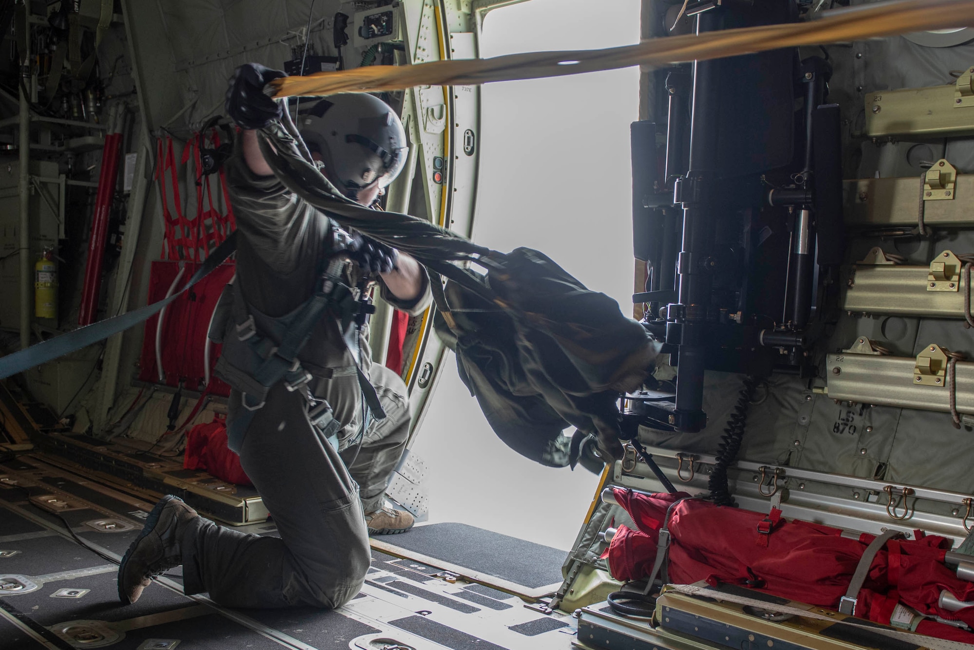 Staff Sgt. Zach Barnes, 36th Airlift Squadron loadmaster, retrieves the deployment bags after a static line jump demonstration at the 2018 Japanese-American Friendship Festival at Yokota Air Base, Japan, Sept. 16, 2018.