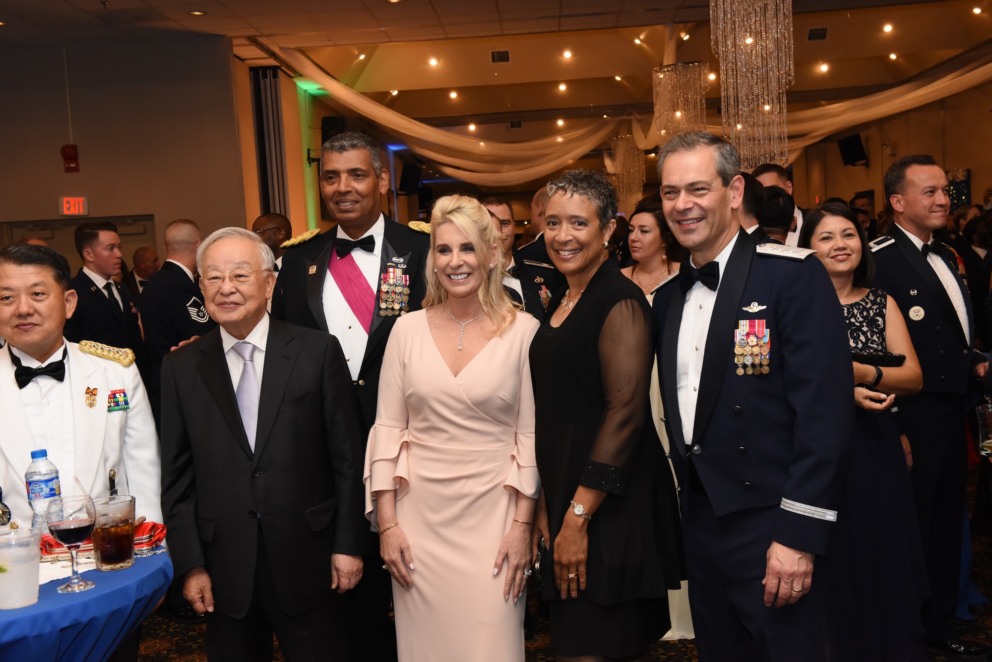U.S. Army Gen. Vincent K. Brooks, U.S. Forces Korea and United Nations Command commander, Lt. Gen. Kenneth S. Wilsbach, Seventh Air Force commander, thier wives, and other distinguished guests pose for a photo at an Air Force 71st Birthday Ball held at Osan Air Base, Republic of Korea, September 15, 2018.
