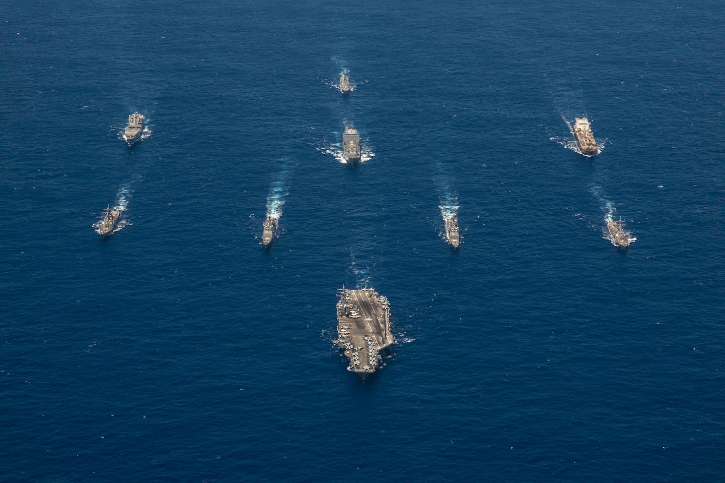 PHILIPPINE SEA (Sept. 17, 2018) The aircraft carrier USS Ronald Reagan (CVN 76) leads the Ronald Reagan Strike group, including the Ticonderoga-class missile cruisers USS Antietam (CG 54) and USS Chancellorsville (CG 62) and the Arleigh Burke-class guided-missile destroyers USS Benfold (DDG 65) and USS Milius (DDG 69), during exercise Valiant Shield 2018.