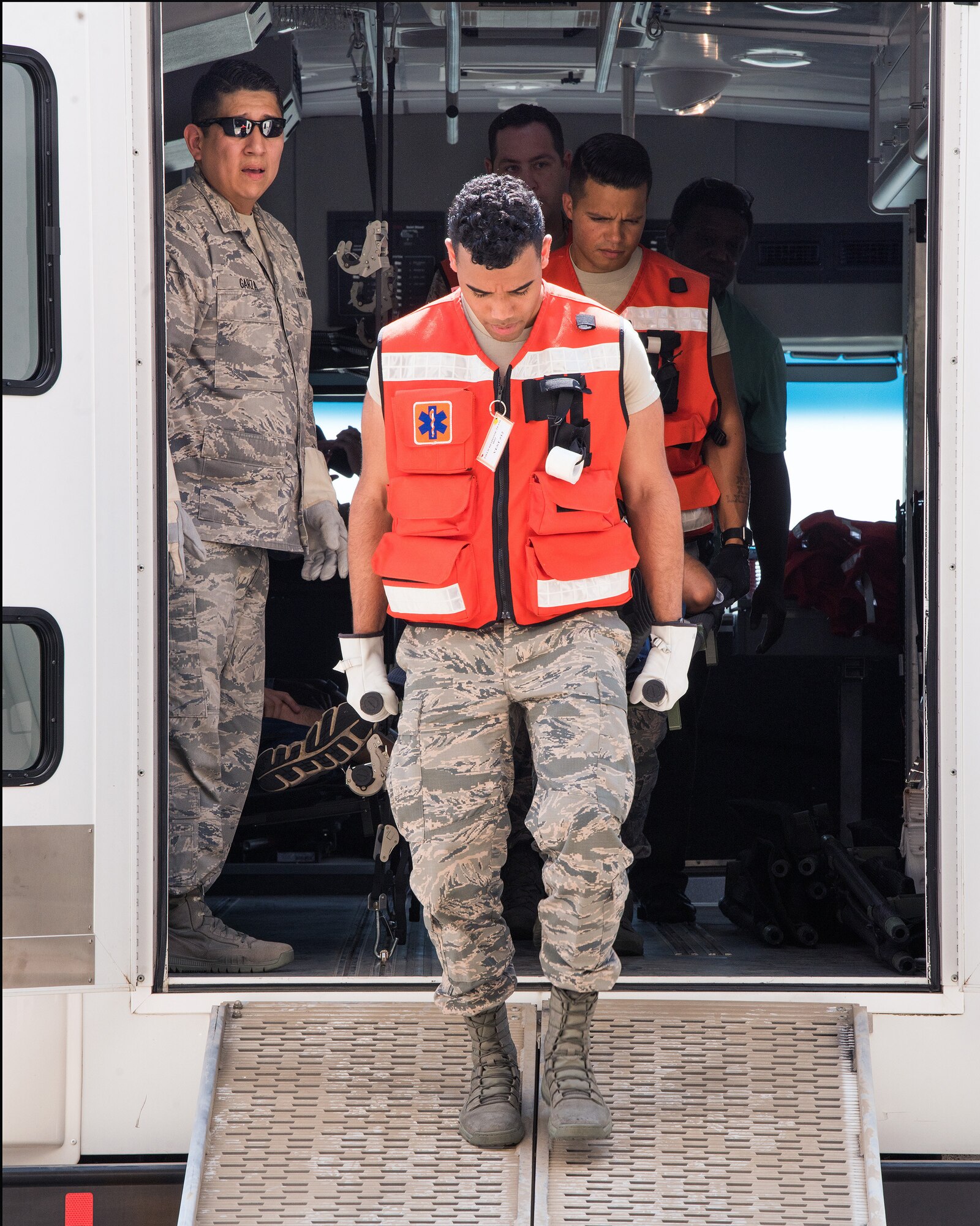 U.S. Airmen from the 60th Medical Group, Travis Air Force Base, California, transport a simulated patient during Exercise Ultimate Caduceus 2018 at Mather Airport, Sacramento, California, Aug. 23, 2018. Ultimate Caduceus 2018 is an annual patient movement exercise designed to test the ability of U.S. Transportation Command to provide medical evacuation. (U.S. Air Force photo by Louis Briscese)