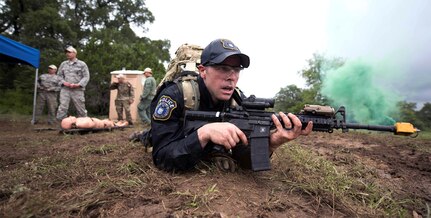 U.S. Air Force Airmen with Air Education and Training Command compete in a dismounted operation competition during Air Force Defender Challenge Sept. 12 at Joint Base San Antonio-Camp Bullis. During the challenge, Airmen are placed into a four-person team and move as quickly as possible across a 3-6 mile distance, while using teamwork to overcome physical and mental barriers.