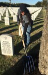 A volunteer assists in landscaping at Fort Sam Houston National Cemetery. Registration in the Volunteer Management Information System benefits volunteers and organizations seeking volunteers at Joint Base San Antonio.