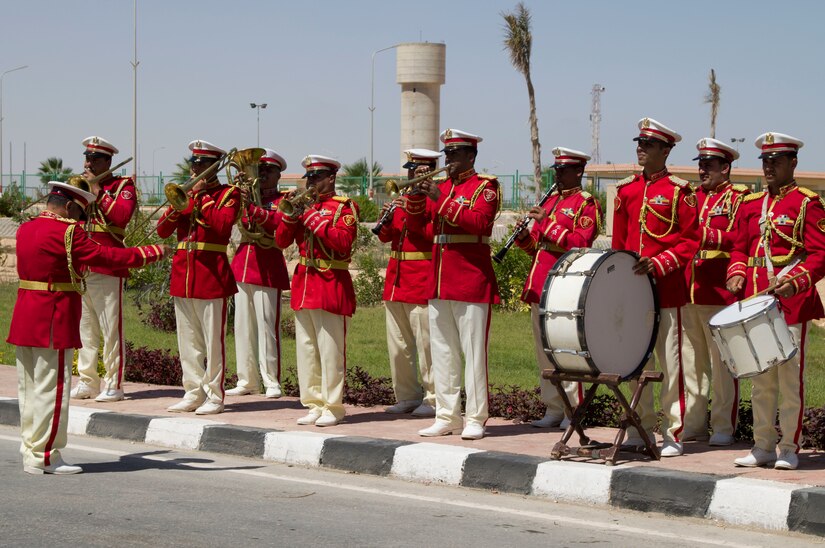 Members of the Egyptian military band greet the generals and senior military personnel with music as they assemble outside of the Mohamed Naguib Military Base Auditorium for a group photo, Sept. 8, 2018.