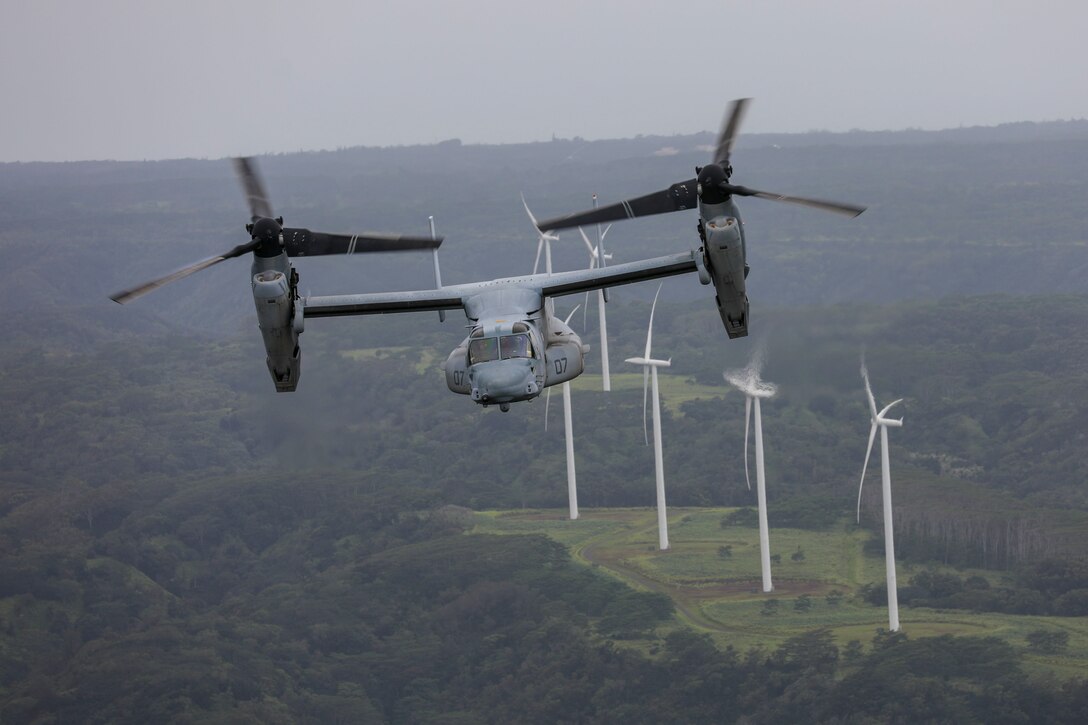 An MV-22 Osprey aircraft assigned to Marine Medium Tiltrotor Squadron 363, flies over jungle terrain during a confined area landing exercise near the Kahuku Training Area, Sept. 13, 2018. The training provided an opportunity for pilots and crew chiefs to improve their proficiency and experience in flying around a tropical environment.