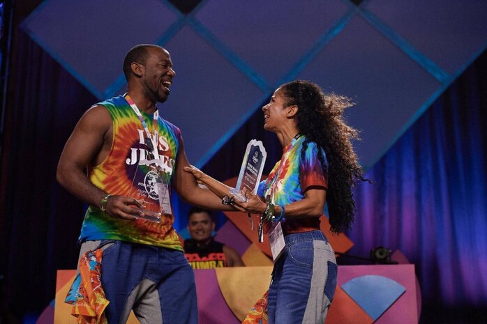 Robert Powell, Space and Naval Warfare Systems Center Atlantic computer scientist, and Rose Marie Berberena, fitness partner, receive the Inspiration of the Year Award at a fitness conference attended by more than 7,000 instructors from around the world.