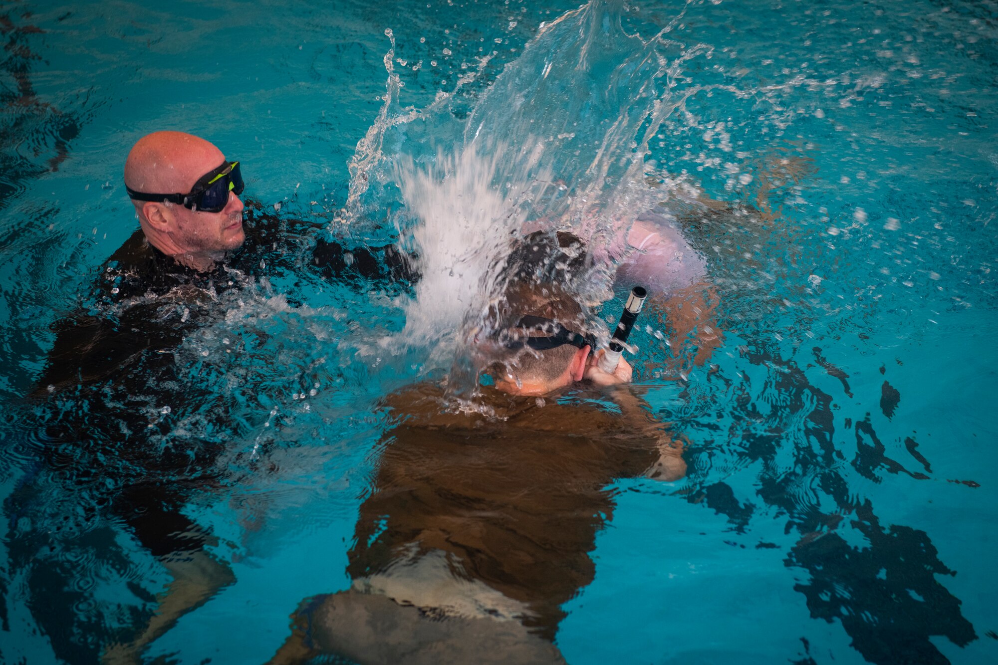 Joe De Sena, founder and CEO of Spartan Race, buddy breathes with a Special Tactics student during a pre-scuba class at Hurlburt Field, Florida, Sept. 5, 2018.