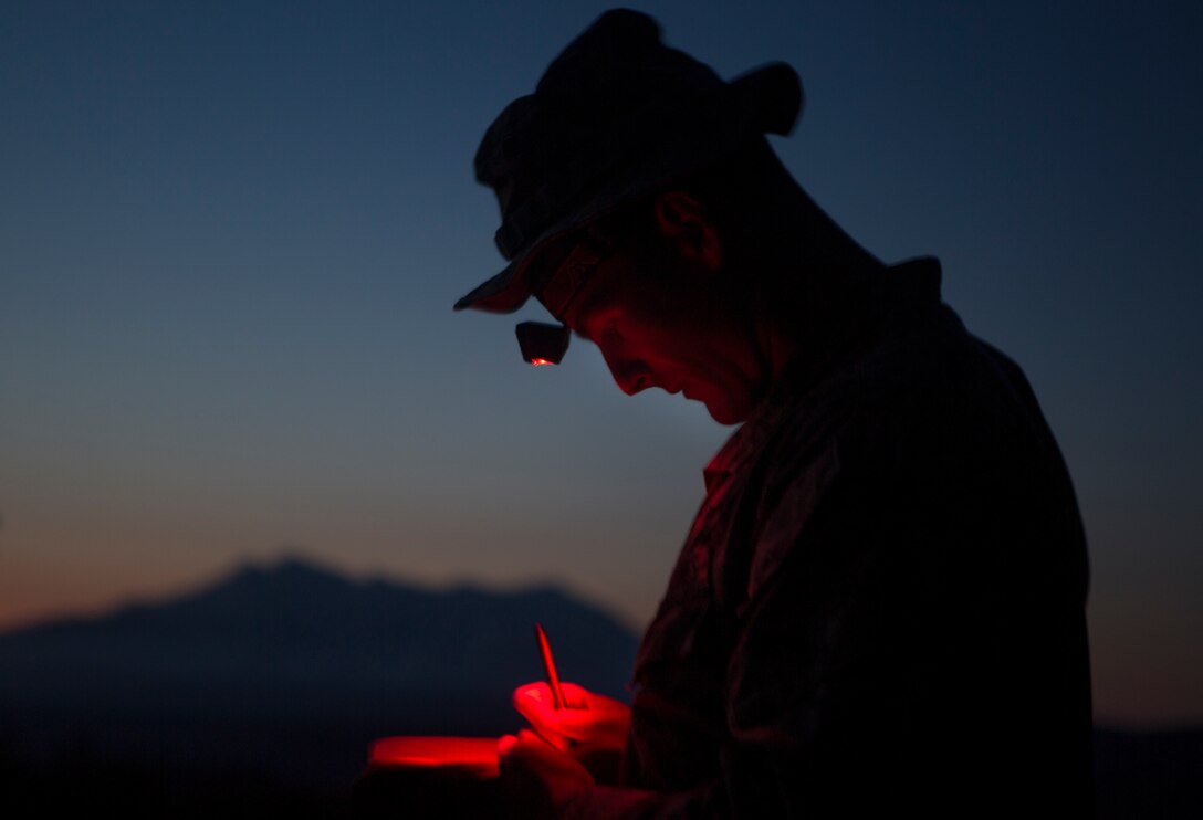 U.S. Marine Capt. David Christie records target grids as part of exercise Joint Assault Signals Company Black, Waiouru Military Camp, New Zealand, Sept. 12, 2018. Christie, a native of Annandale, Va., is the Fire Power Control Team lead with 1st Brigade, 5th Air Naval Gunfire Liaison Company, III Marine Expeditionary Force Information Group.