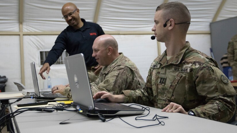 U.S. Army Capt. Jerry E. Thompson, middle, post chaplain for Camp Buehring, and U.S. Army Capt. Peter C. Wojtal, right, the incoming officer in charge of the U.S. Army Central Readiness Training Center, receive instructions on setting up voice recognition technology from Carey W. Menifee, an Intelligence and Electronic Warfare Tactical Proficiency Trainer operator and maintainer, before engaging in a suicide prevention virtual training exercise at Camp Buehring, Kuwait, Sept. 12, 2018. Suicide prevention is an enduring goal of the U.S. Army to ensure the safety and well-being of all Soldiers, Department of the Army civilians, and contractors.