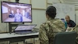 U.S. Army Master Sgt. Breyda Pereyra, the noncommissioned officer in charge of U.S. Army Central's G37 office, speaks with a virtual Soldier avatar in an Intelligence and Electronic Warfare Tactical Proficiency Trainer program designed to simulate a conversation with a Soldier having suicidal thoughts, Camp Buehring, Kuwait, Sept. 12, 2018. Suicide prevention is an enduring goal of the U.S. Army to ensure the safety and well-being of all Soldiers, Department of the Army civilians, and contractors.