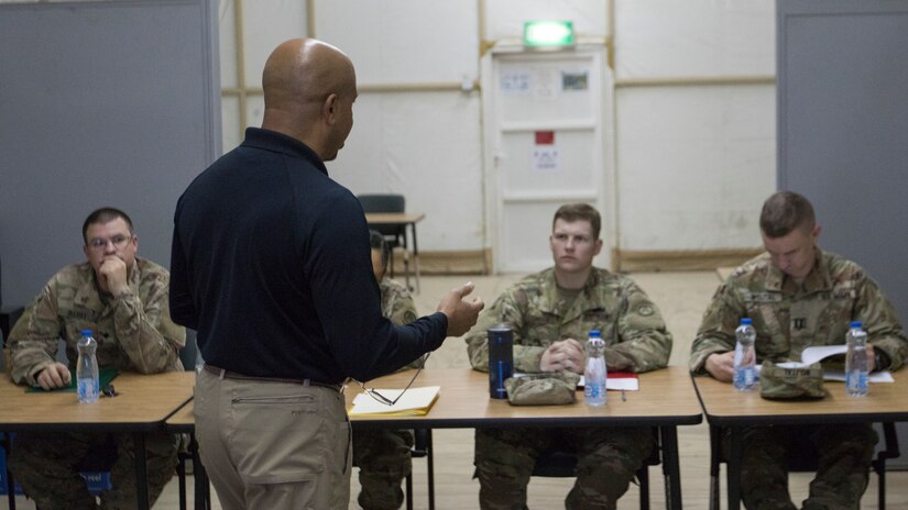 U.S. Army Soldiers from the U.S. Army Central Readiness Training Center learn about the capabilities of the Intelligence and Electronic Warfare Tactical Proficiency Trainer from Carey W. Menifee, an IEWTPT operator and maintainer, before engaging in a virtual training exercise at Camp Buehring, Kuwait, Sept. 12, 2018. The IEWTPT provides Soldiers with the capability to augment their suicide prevention training with a virtual scenario in which they counsel a Soldier experiencing suicidal thoughts.