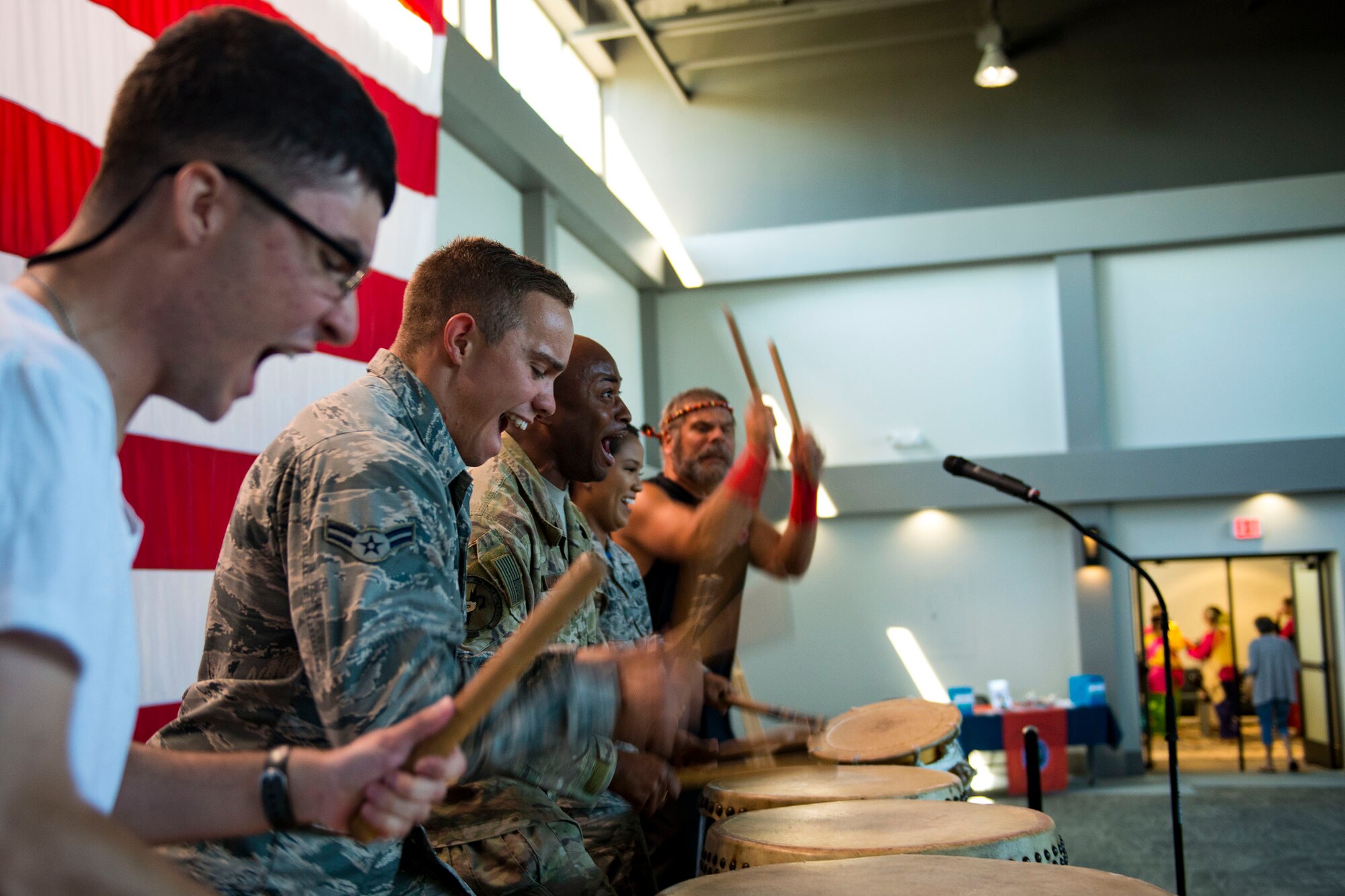 Team Moody Airmen participate in a drumming demonstration with the Tampa Taiko drummers during the 23d Wing Diversity Day, Sept. 14, 2018, at Moody Air Force Base, Ga. Diversity Day honored the cultures of all groups and organizations observed by the Department of Defense using forms of expression such as poems and native dances. The theme of this year was ’Many Cultures, One Voice: Stronger Through Inclusion And Equality’. (U.S. Air Force photo by Airman 1st Class Erick Requadt)