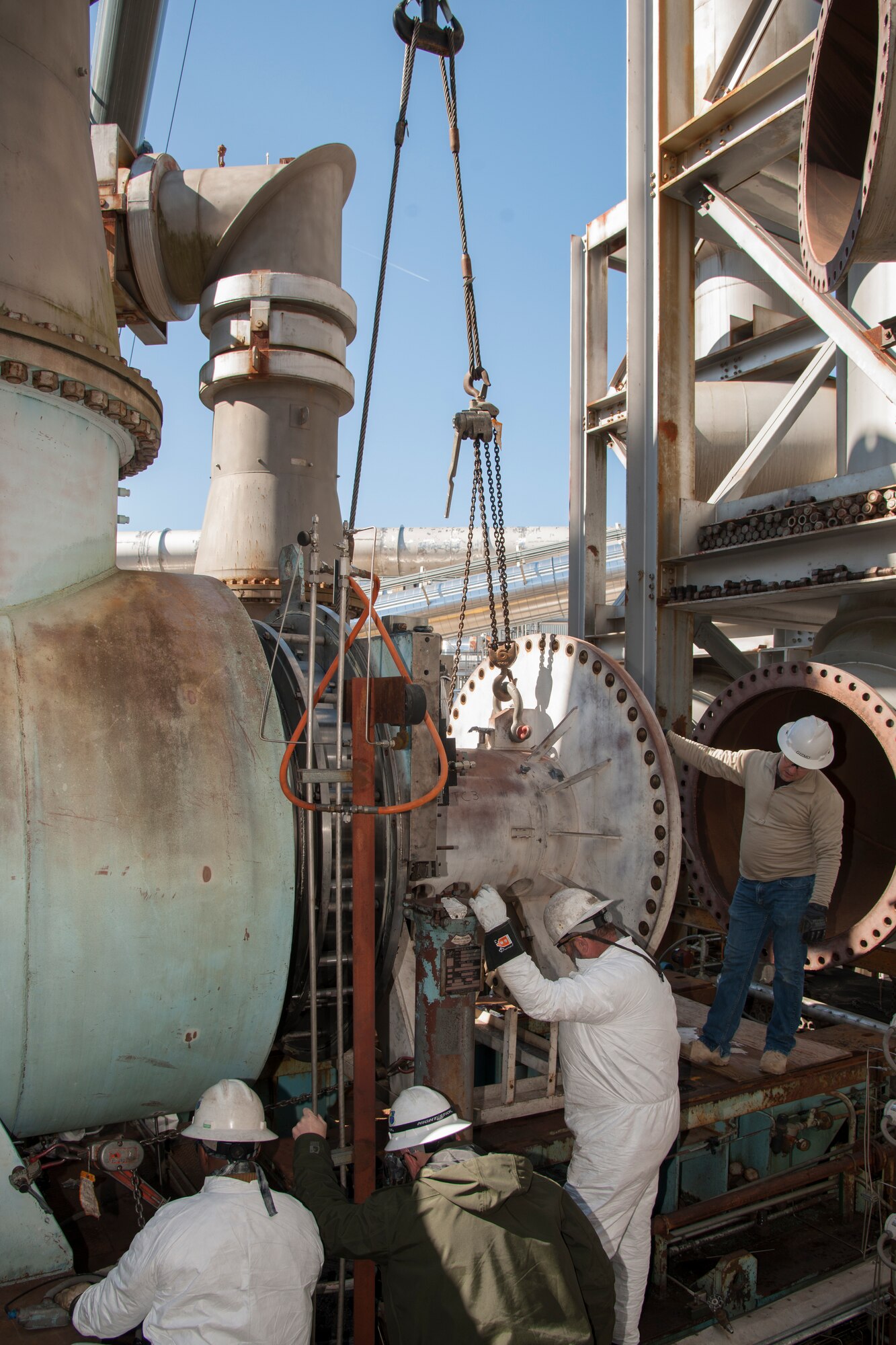 AEDC outside machinists and boilermakers perform maintenance on the C-Plant Turbine Chiller 3, or TC3, in February of 2018, in support of the engine test facilities at Arnold Air Force Base. Similar equipment was replaced after an inspection determined some deficiencies. The equipment was replaced before the annual maintenance outage for the Aeropropulsion Combined Test Force and within just enough time to complete a customer test. (U.S. Air Force photos)