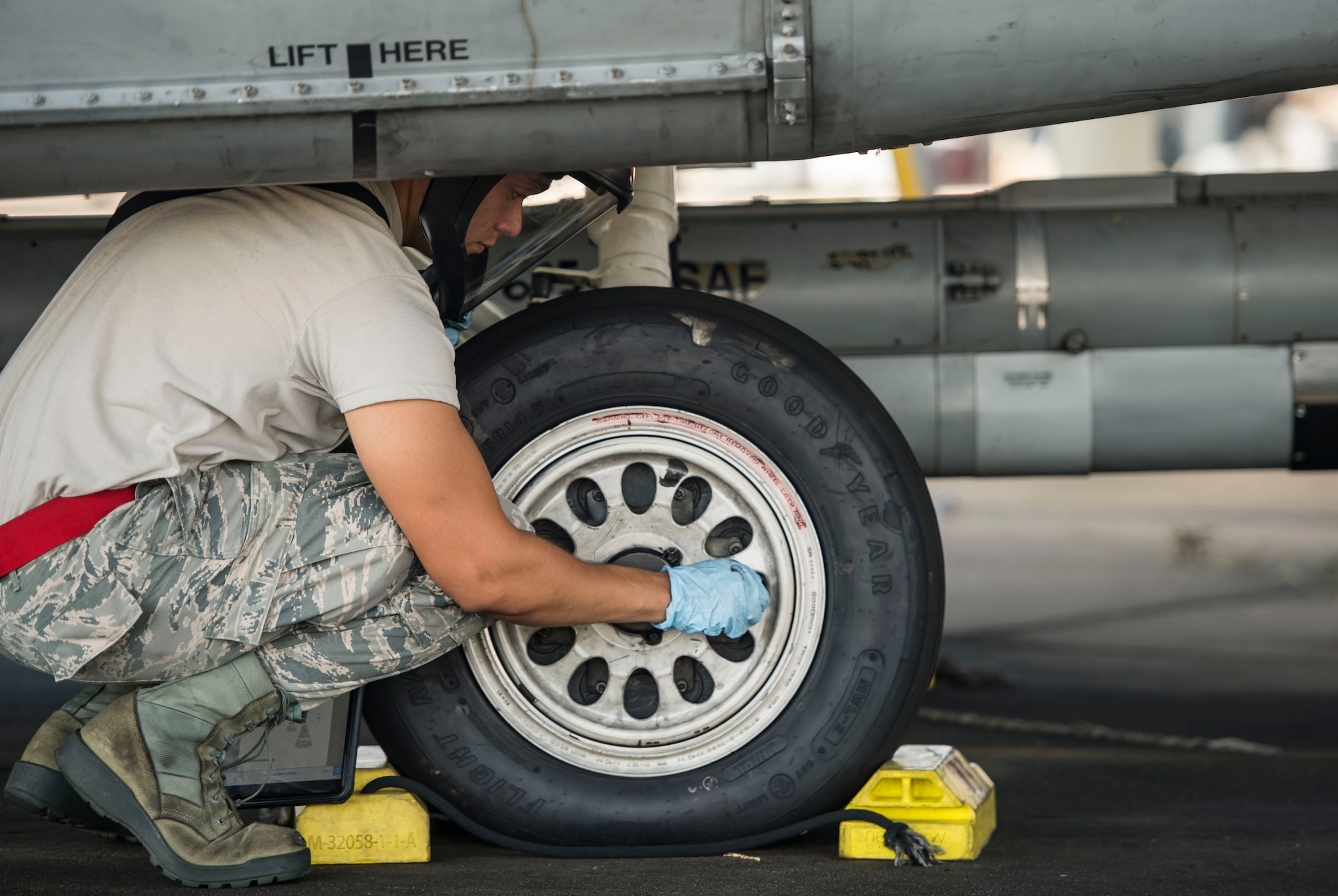 A 20th Aircraft Maintenance Squadron tactical aircraft maintainer checks the tire pressure of an F-16CM Fighting Falcon at Shaw Air Force Base, S.C., Sept. 11, 2018.