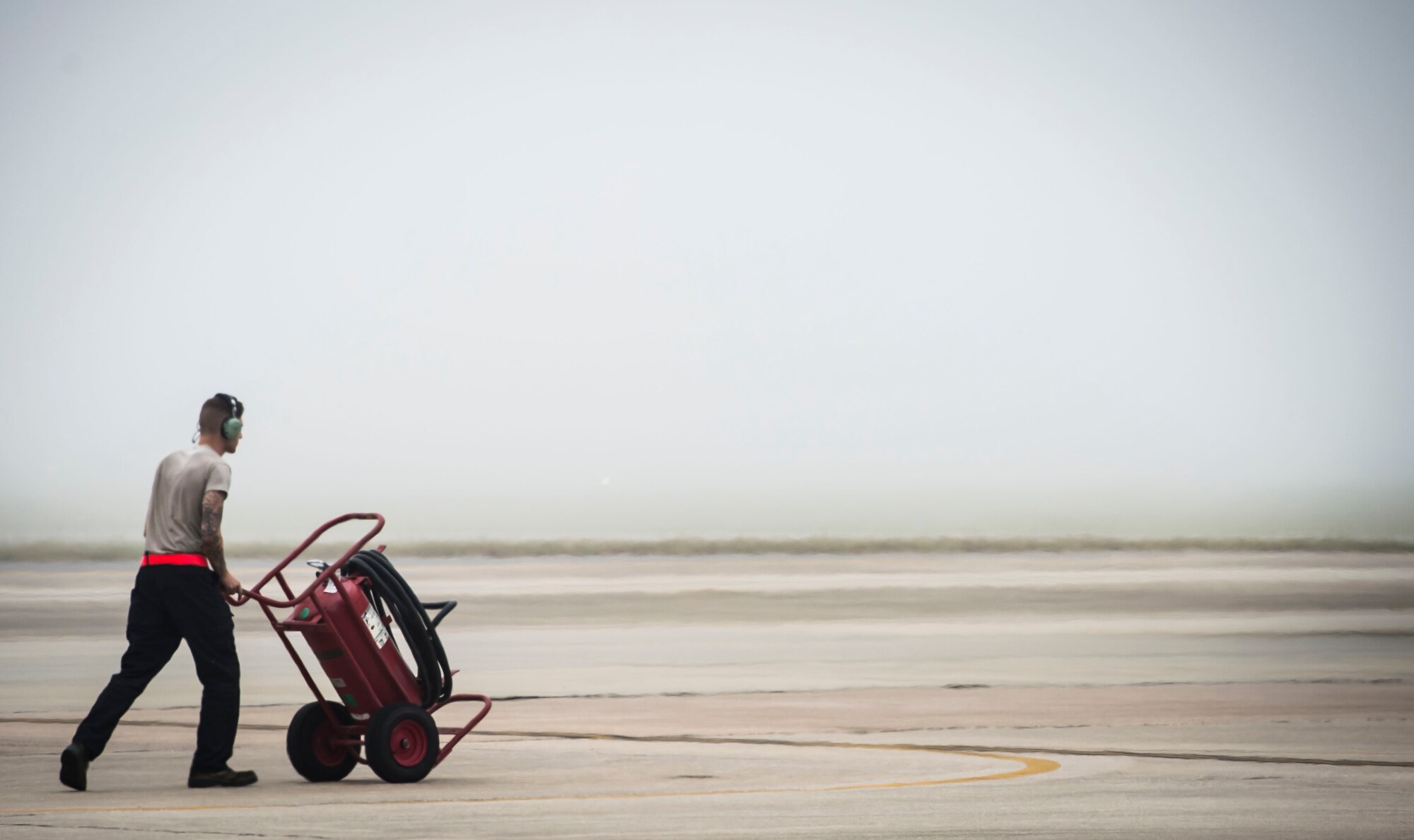 A 20th Aircraft Maintenance Squadron tactical aircraft maintainer walks the flightline at Shaw Air Force Base, S.C., Sept. 12, 2018.