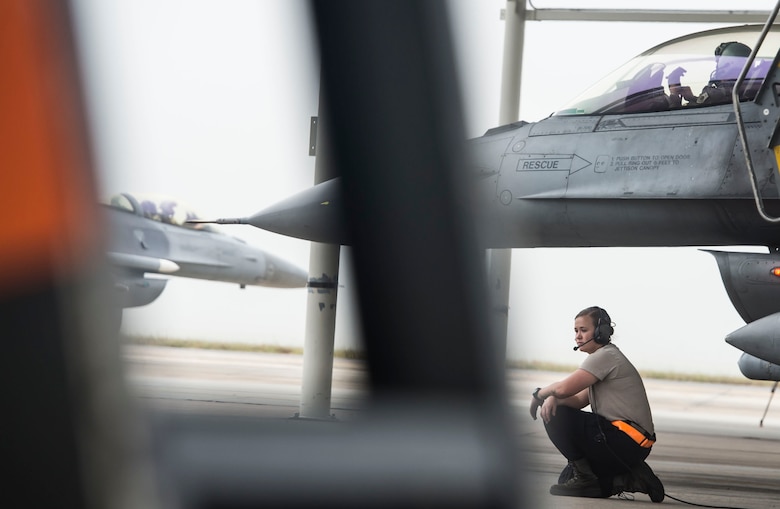 A 20th Aircraft Maintenance Squadron tactical aircraft maintainer waits to marshal their jet at Shaw Air Force Base, S.C., Sept. 12, 2018.