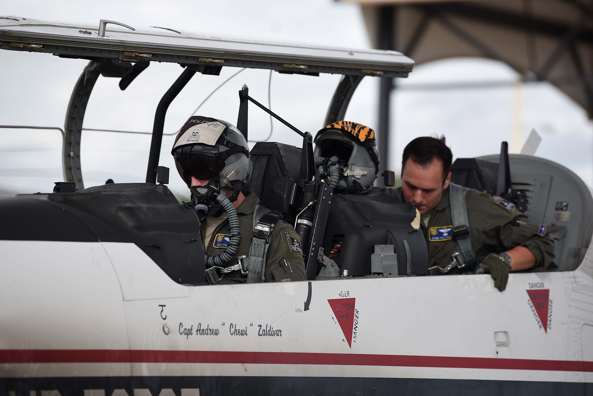 First Lt. David Polzin, 37th Flying Training Squadron instructor pilot, and Maj. Ryan Sullivan, 37th FTS chief of standards and evaluation, prepares for an evaluation flight Sept. 5, 2018, on Columbus Air Force Base, Mississippi. All instructor pilots must meet specific standards in order to train student pilots in each airframe. (U.S. Air Force photo by Airman 1st Class Keith Holcomb)