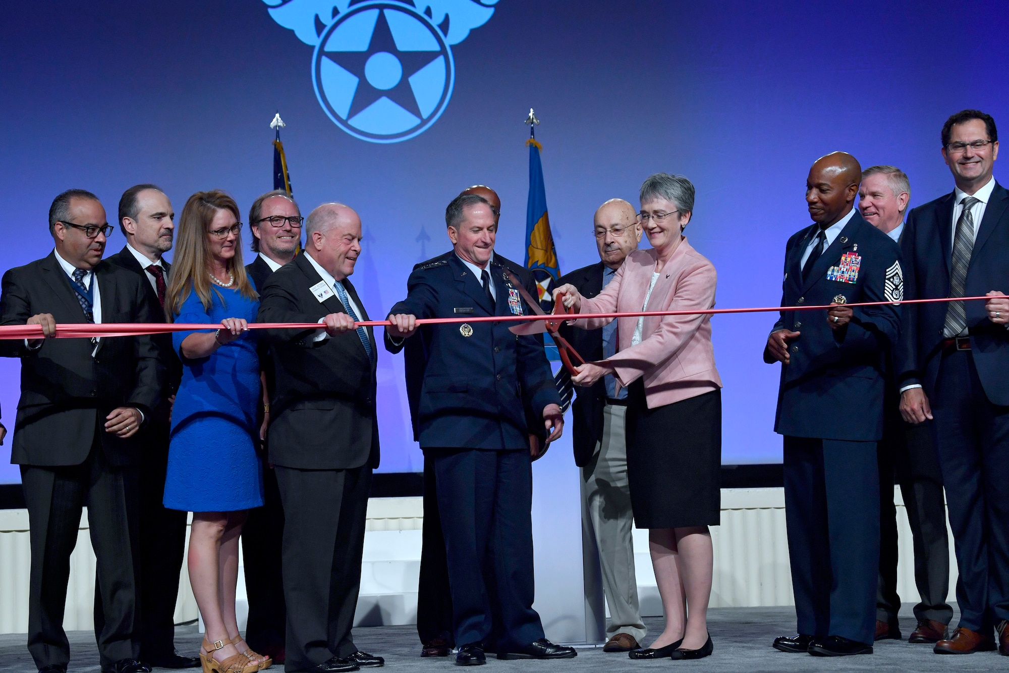 Secretary of the Air Force Heather Wilson, Air Force Chief of Staff Gen. David L. Goldfein, Chief Master Sgt. of the Air Force Kaleth O. Wright and Air Force Association leadership cut a ribbon during the 2018 AFA Air, Space and Cyber Conference in National Harbor, Md., Sept. 17, 2018. Cutting the ribbon symbolized the opening of the conference's exhibition hall. (U.S. Air Force photo by Wayne Clark)