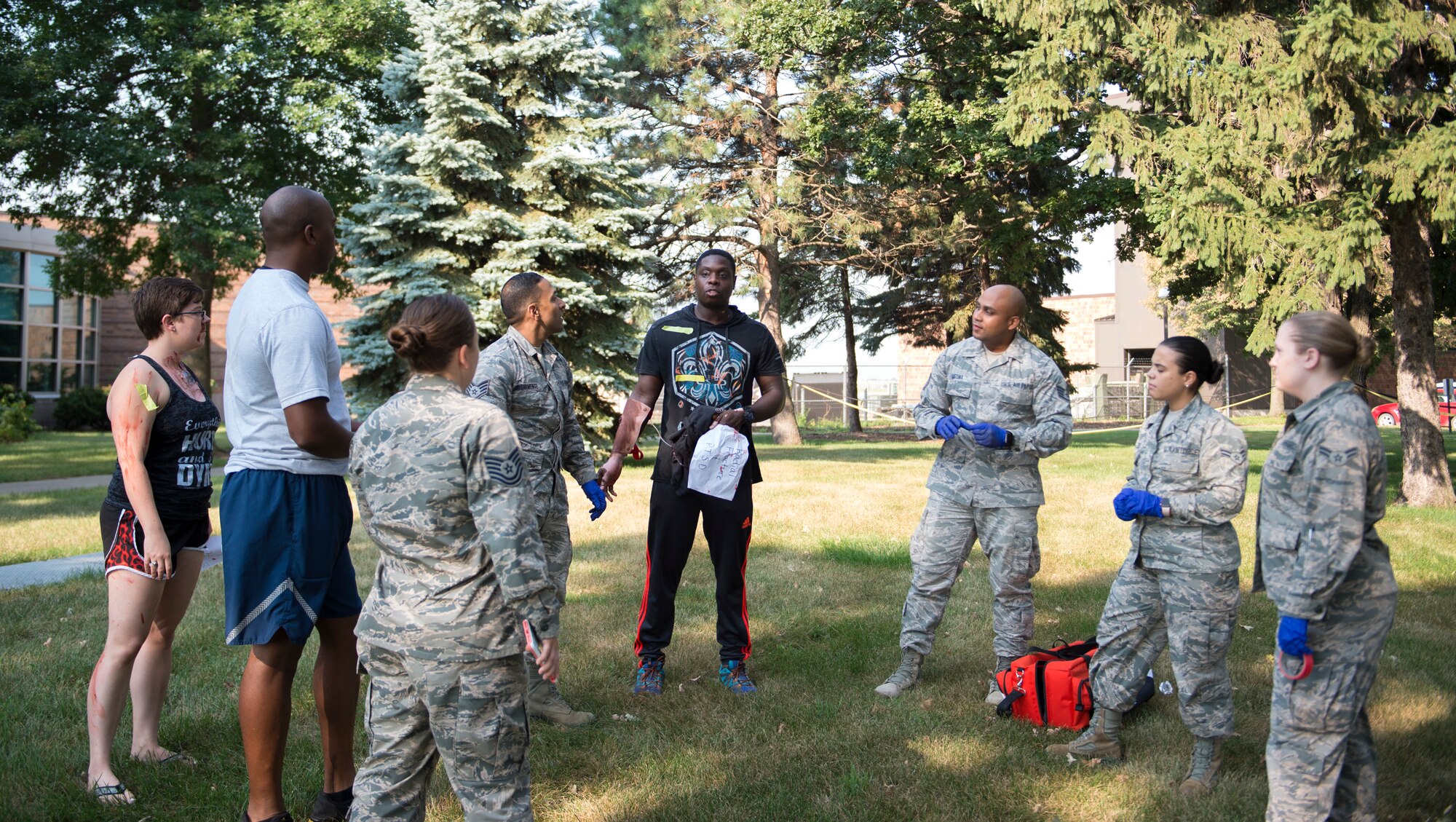 Emergency medical technicians, from the U.S. Air National Guard, receive feedback from instructors in St. Paul, Minn., Aug. 16, 2018.