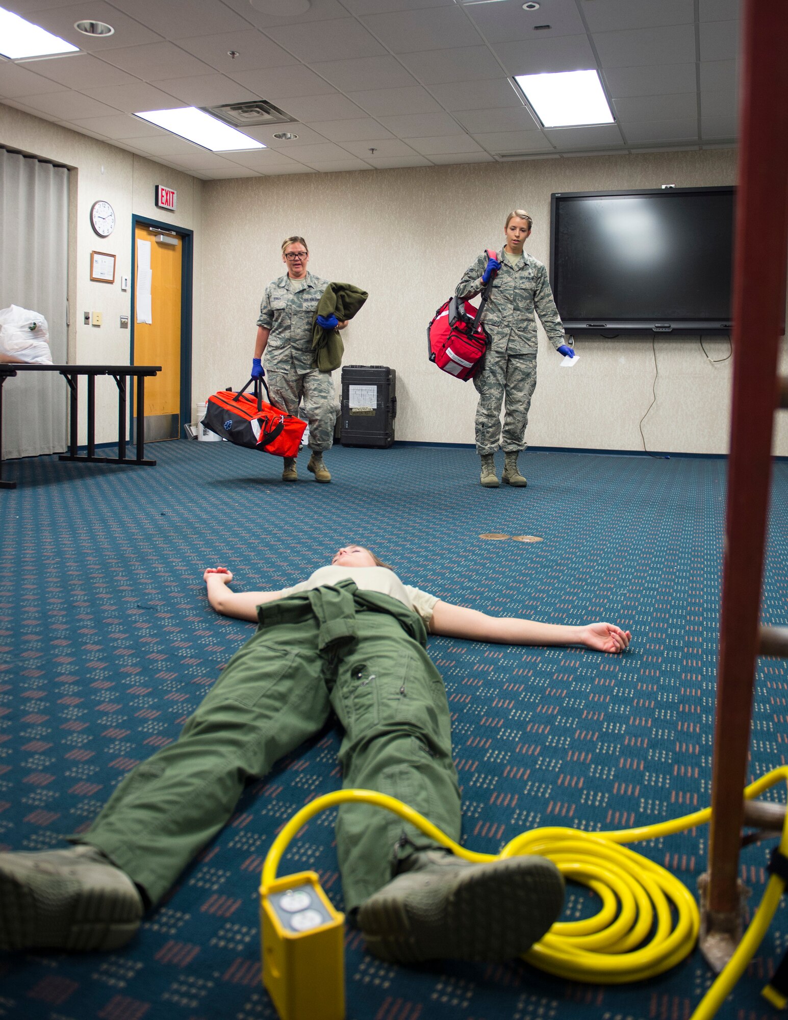 U.S. Air Force Tech. Sgt. Courtney Bosch and Airman 1st Class Victoria Mook, emergency medical technicians, arrive on scene to a medical emergency scenario in St. Paul, Minn., Aug. 17, 2018.