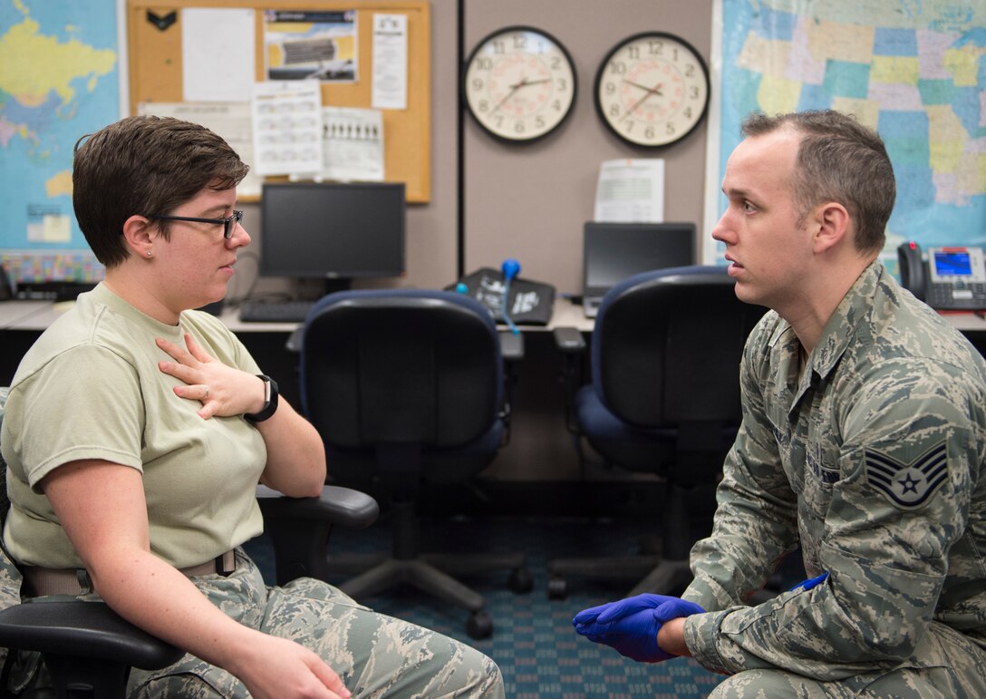 U.S. Air Force Staff Sgt. Patrick Doheney, right, an emergency medical technician with the 146th Medical Group, assesses a role-player’ symptoms in St. Paul, Minn., Aug. 17, 2018.