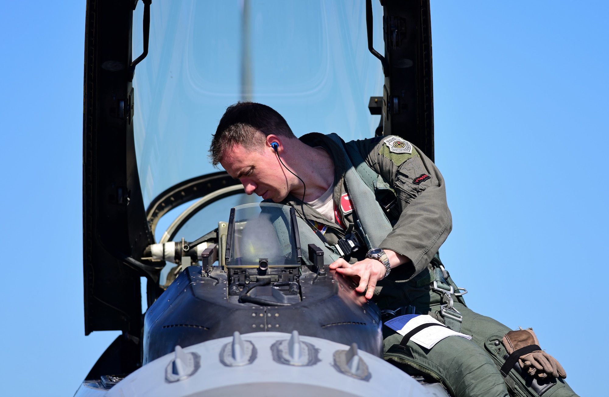 An F-16 Fighting Falcon pilot from the 20th Fighter Wing at Shaw Air Force Base, S.C., prepares to disembark the aircraft after landing at Tyndall Air Force Base, Fla., Sept. 12, 2018. Shaw evacuated assets to Tyndall from both the 77th and 79th Fighter Squadrons to escape the path of Hurricane Florence. (U.S. Air Force photo by Senior Airman Isaiah J. Soliz)