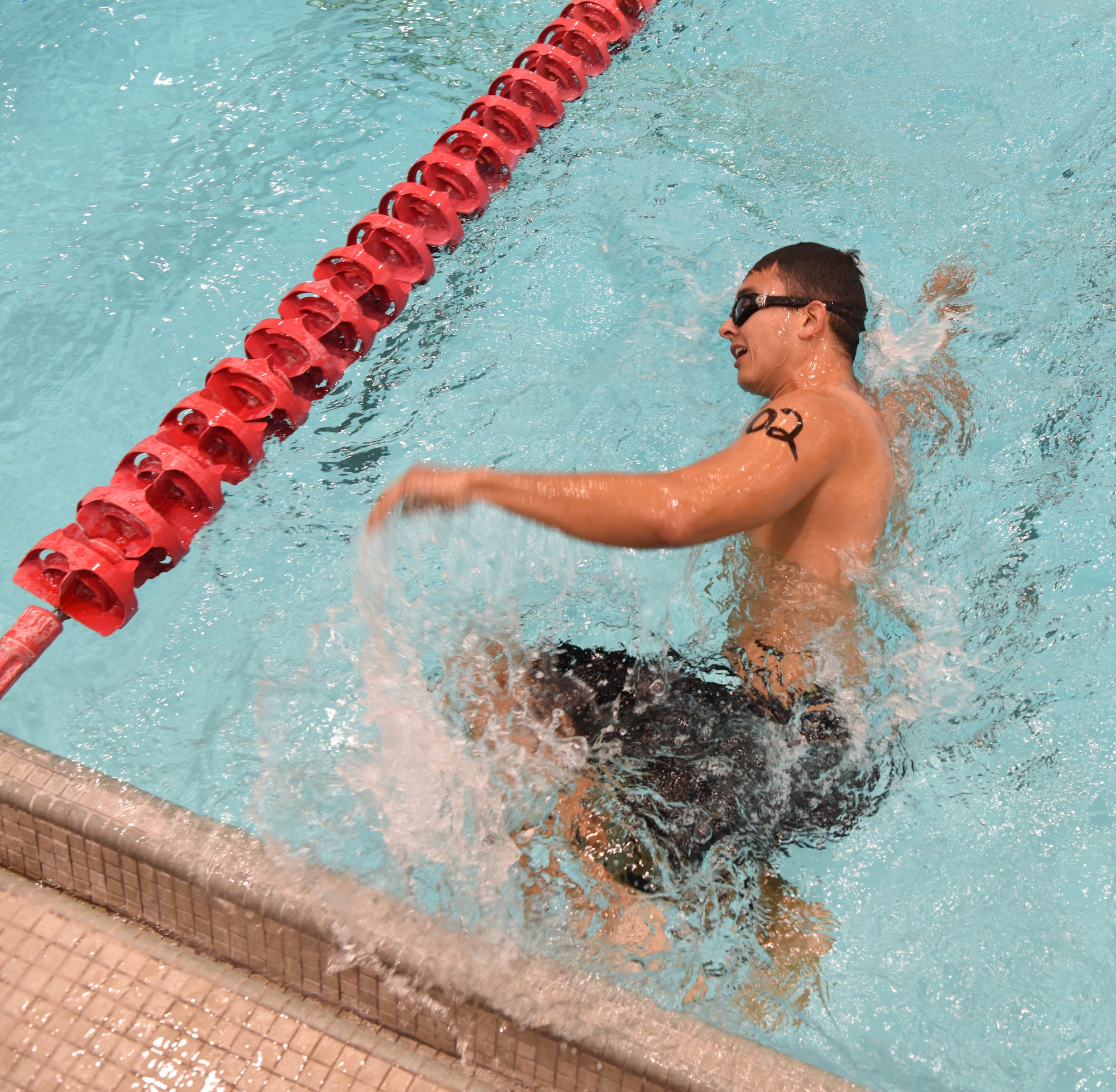 Staff Sgt. Roger Barrett, a 28th Maintenance Squadron aerospace ground equipment technician, turns around to start another lap in a pool at Ellsworth Air Force Base, S.D., Sept. 15, 2018. The 28th Force Support Squadron hosted the tri-to-b1 triathlon, which consisted of a 500-meter swim, a five-kilometer run and a 10-kilometer bicycle ride. (U.S. Air Force Photo by Airman 1st Class Thomas Karol)