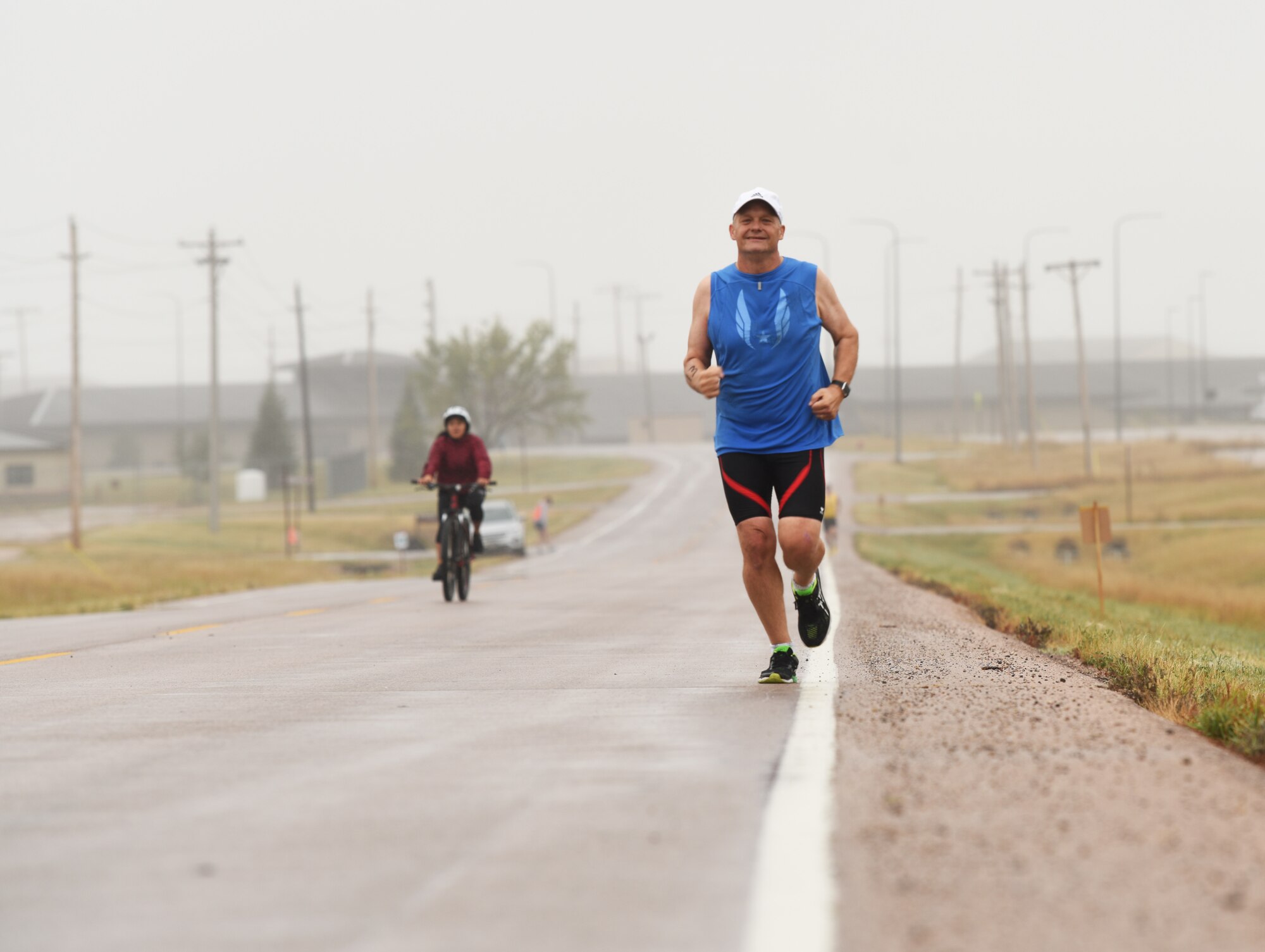 Jens Christenson, a 28th Civil Engineer Squadron engineer, runs a five kilometer race as part of a triathlon at Ellsworth Air Force Base, S.D., Sept. 15, 2018. The 28th Force Support Squadron hosted the tri-to-b1 triathlon, which consisted of a 500-meter swim, a five-kilometer run and a 10-kilometer bicycle ride. (U.S. Air Force Photo by Airman 1st Class Thomas Karol)