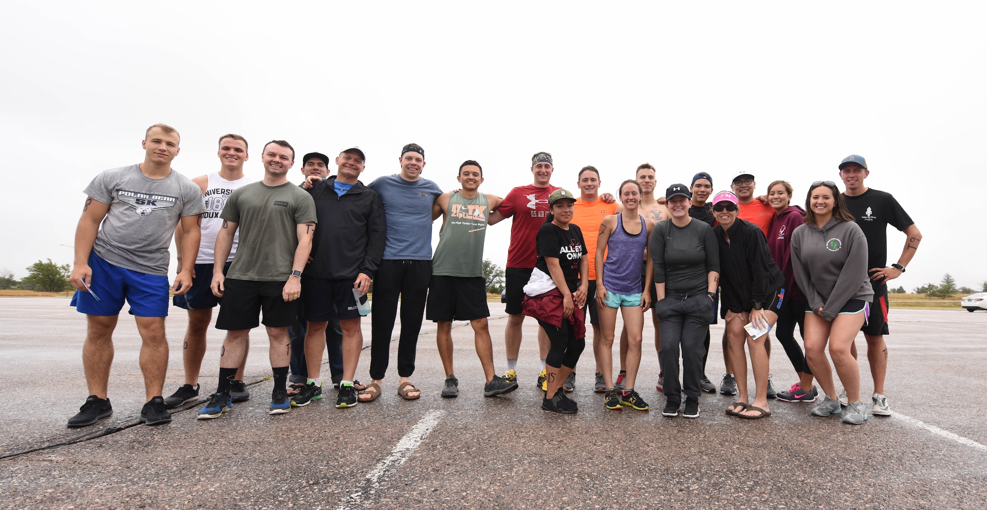 Participants of the tri-to-b1 triathlon, pose for a picture at Ellsworth Air Force Base, S.D., Sept. 15, 2018. The 28th Force Support Squadron hosted the tri-to-b1 triathlon, which consisted of a 500-meter swim, a five-kilometer run and a 10-kilometer bicycle ride. (U.S. Air Force Photo by Airman 1st Class Thomas Karol)