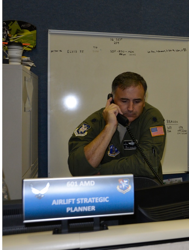 Lt. Col. Lewis Hagler, 601st Air Operations Center Air Mobility Division, chief, air mobility execution, discusses potential airlift operations for Hurricane Florence. Total Force representation during AFNORTH’s Defense Support of Civil Authorities efforts includes active-duty U.S. Navy, U.S. Marine Corps, U.S. Army, U.S. Coast Guard, and U.S. Air Force, Guard, Reservists and civilians. (Air Force photo by Mary McHale)