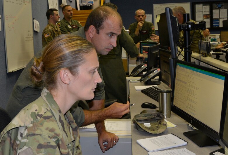 Within the 601st Air Operation Center’s Air Mobility Division, Master Sgt. Renea Zachary, a U.S. Air Force Reservist deployed from the 349th Air Mobility Operations Squadron, Travis Air Force Base, Calif. and Maj. Dan Steinhiser, 601st AOC/AMD airlift control team chief, review airlift information for potential airlift operations during Hurricane Florence.  Total Force representation during AFNORTH’s Defense Support of Civil Authorities efforts includes active-duty U.S. Navy, U.S. Marine Corps, U.S. Army, U.S. Coast Guard, and U.S. Air Force, Guard, Reservists and civilians. (Air Force photo by Mary McHale)

 Within the 601st Air Operation Center’s Air Mobility Division, Master Sgt. Renea Zachary, a U.S. Air Force Reservist deployed from the 349th Air Mobility Operations Squadron, Travis Air Force Base, Calif. and Maj. Dan Steinhiser, 601st AOC/AMD airlift control team chief, review airlift information for potential airlift operations during Hurricane Florence.  Total Force representation during AFNORTH’s Defense Support of Civil Authorities efforts includes active-duty U.S. Navy, U.S. Marine Corps, U.S. Army, U.S. Coast Guard, and U.S. Air Force, Guard, Reservists and civilians. (Air Force photo by Mary McHale)

Within the 601st Air Operation Center’s Air Mobility Division, Master Sgt. Renea Zachary, a U.S. Air Force Reservist deployed from the 349th Air Mobility Operations Squadron, Travis Air Force Base, Calif. and Maj. Dan Steinhiser, 601st AOC/AMD airlift control team chief, review airlift information for potential airlift operations during Hurricane Florence.  Total Force representation during AFNORTH’s Defense Support of Civil Authorities efforts includes active-duty U.S. Navy, U.S. Marine Corps, U.S. Army, U.S. Coast Guard, and U.S. Air Force, Guard, Reservists and civilians. (Air Force photo by Mary McHale)
