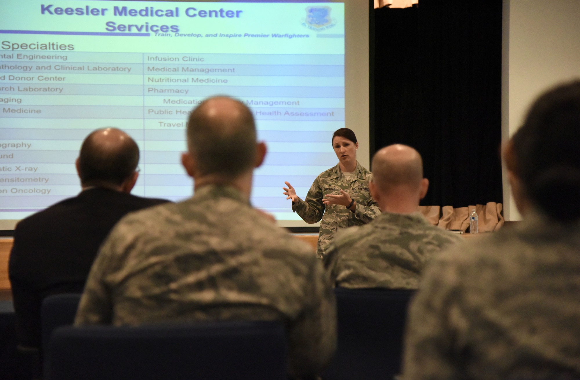 U.S. Air Force Col. Beatrice Dolihite, 81st Medical Group commander, delivers the 81st MDG mission brief to Gen. Stephen Wilson, Vice Chief of Staff of the Air Force; Matthew Donovan, Under Secretary of the Air Force; Lt. Gen. Dorothy Hogg, Air Force Surgeon General, and Keesler Leadership at the Keesler Medical Center auditorium at Keesler Air Force Base, Mississippi, Sept. 10, 2018. The purpose of the visit was to become more familiar with the 81st MDG's mission capabilities prior to Keesler Medical Center's transition to the Defense Health Agency. (U.S. Air Force photo by Kemberly Groue)
