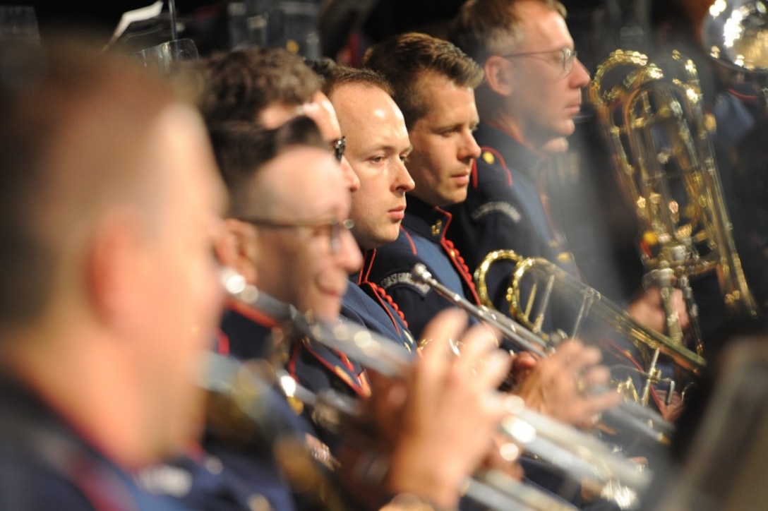 A row of musicians hold their instruments.