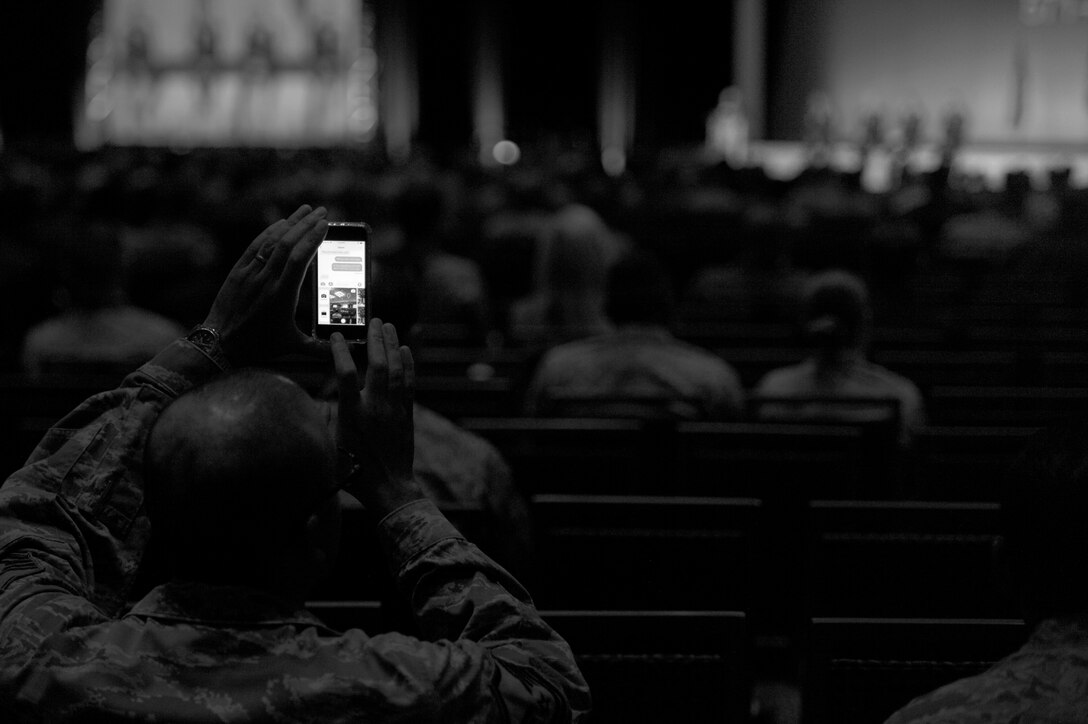 An Airman takes a photo during a panel discussion featuring Gen. Tod D. Wolters, Commander, U.S. Air Forces in Europe, U.S. Air Forces Africa and Commander, Allied Air Command, Gen. John W. Raymond, Commander, Air Force Space Command, Gen. Timothy M. Ray, Commander, Air Force Air Force Global Strike Command and Lt. Gen. Marshall B. Webb, Commander, Air Force Special Operations Command during the Air Force Association’s Air, Space and Cyber Conference in National Harbor, Md., Sept. 17, 2018. The event is a professional development conference that offers an opportunity for Department of Defense personnel to participate in forums, speeches, seminars and workshops. (U.S. Air Force photo/Tech Sgt. Anthony Nelson Jr.)